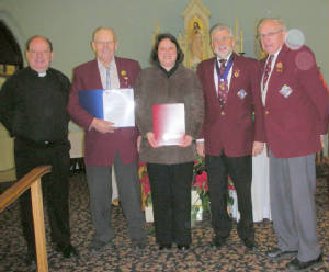 KOFC4949: Grand Knight Guenter A. Rieger presenting a check for $2,5000 to Laura Corduff St.ames Parent Support Group,  and Schubert Centre Society John Toporchak and Romeo Sibellau a check for $1,000